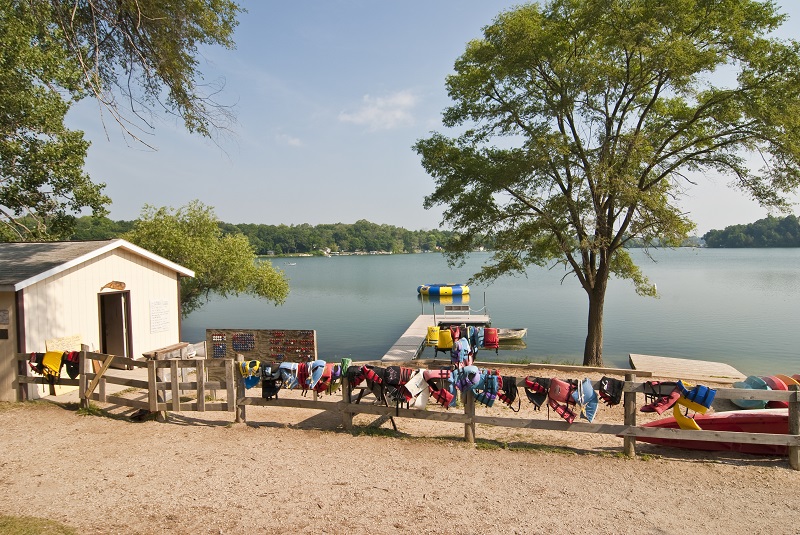 Lake with kayaks at a camp